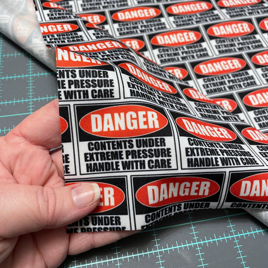 Danger Sign PUL Waterproof Fabric - 1 mil - 60" wide - Contents under pressure handle with care