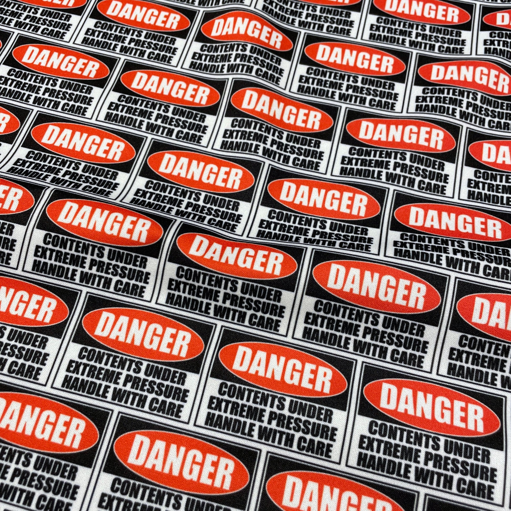 Danger Sign PUL Waterproof Fabric - 1 mil - 60" wide - Contents under pressure handle with care